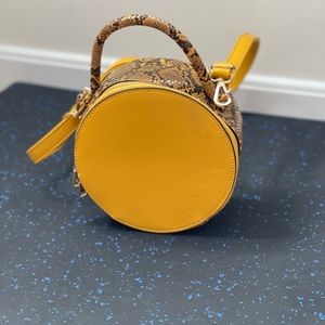 Yellow good leather Vegan hand bag. Can be worn as hand bag and cross body bag.